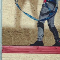 Construction worker on metal scaffolding