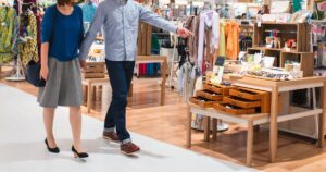 couple walking through retail property