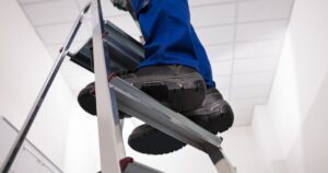 worker using a ladder