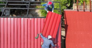 roofers installing metal in unsafe workplace setting
