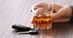 car keys near alcoholic beverage and driver