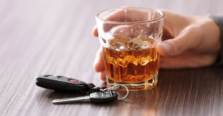 car keys near alcoholic beverage and driver